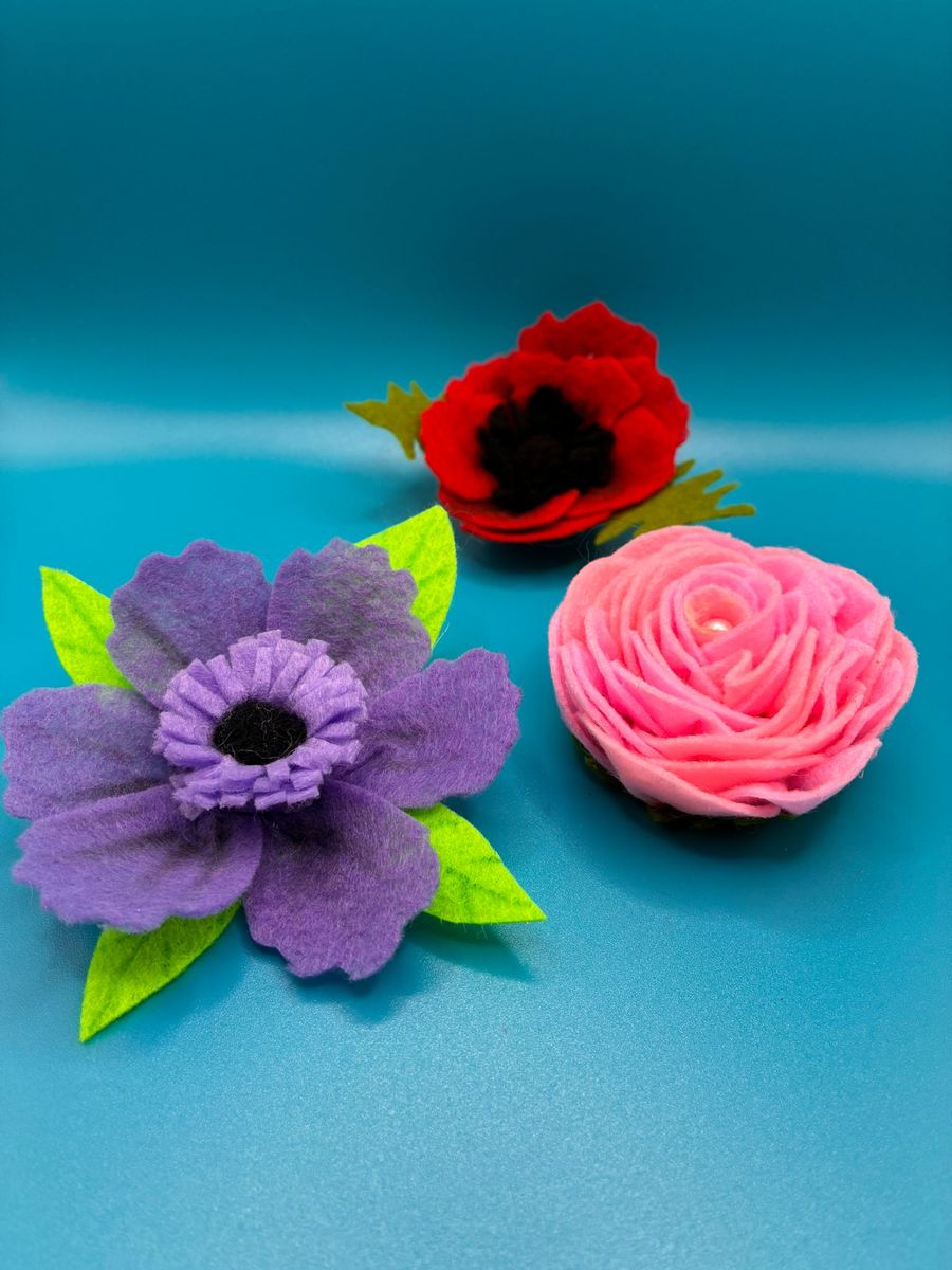 Felt flower pin brooches in purple, red and pink