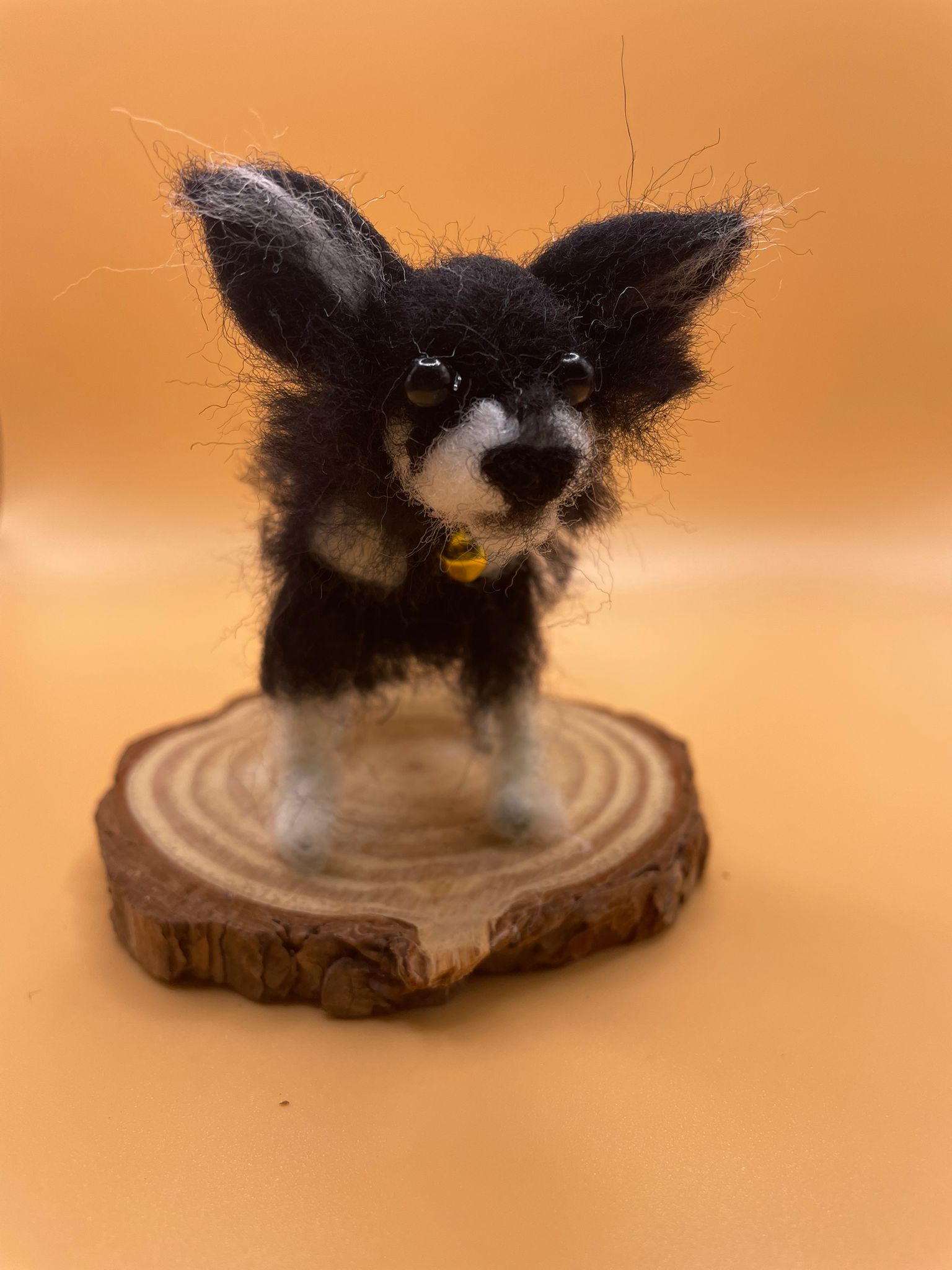 Needle felt small black dog on wood slice