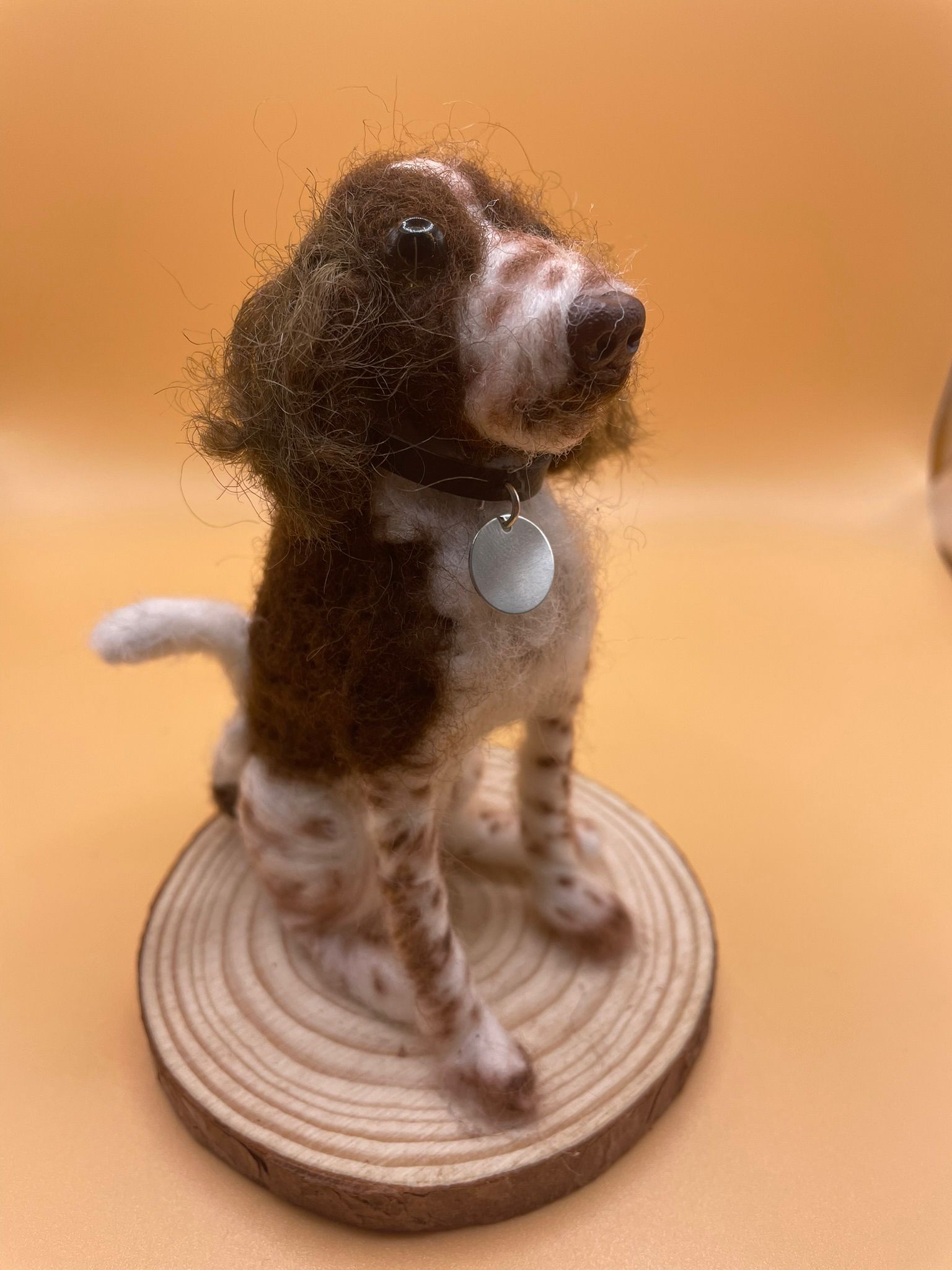 Needle felt dog on wood slice