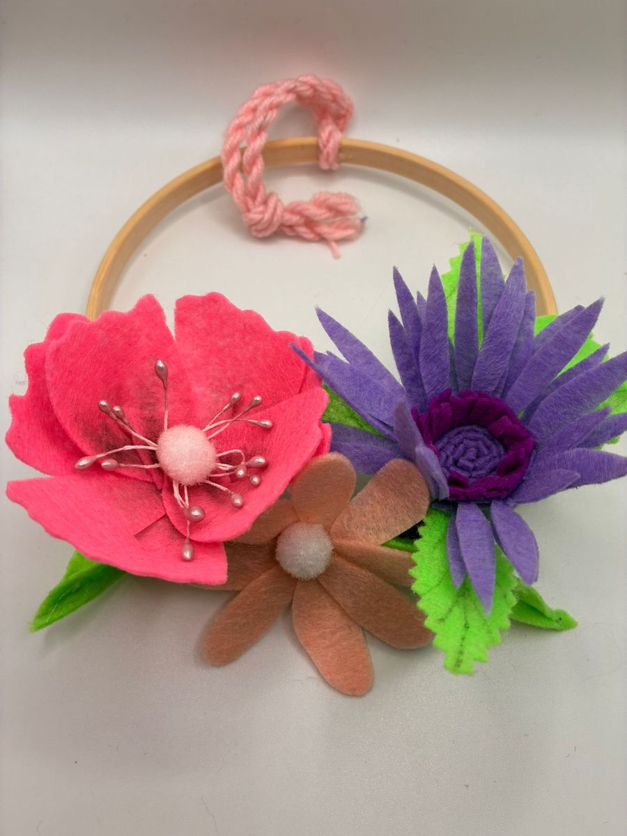 Felt pink poppy and purple flowers on embroidery hoop