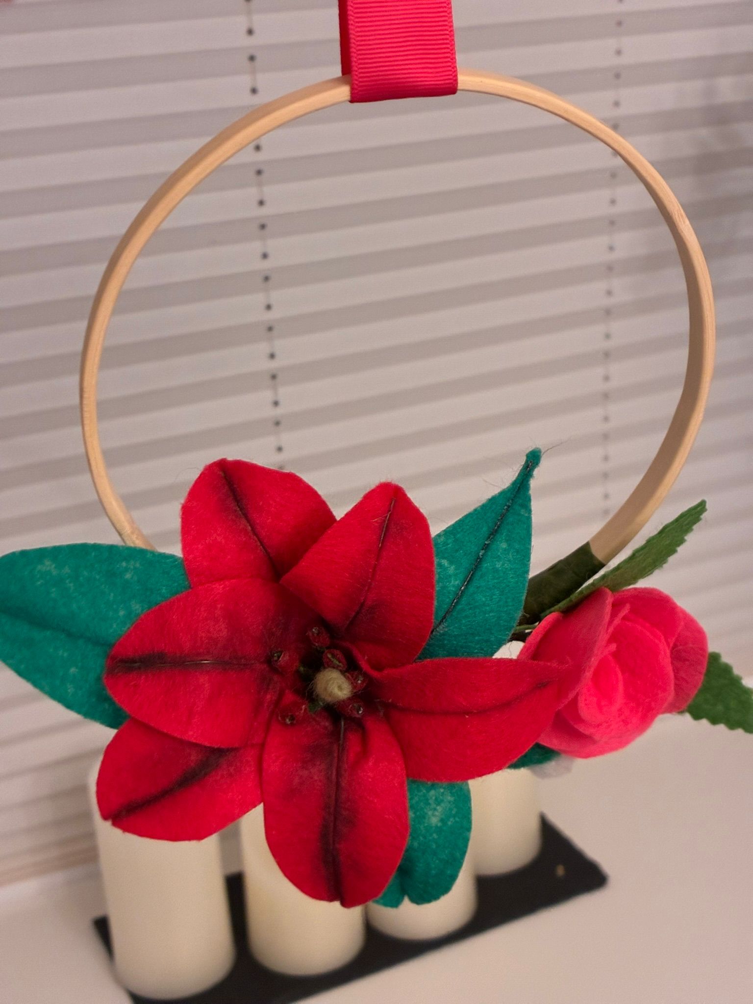 Felt flowers on a wooden embroidery hoop