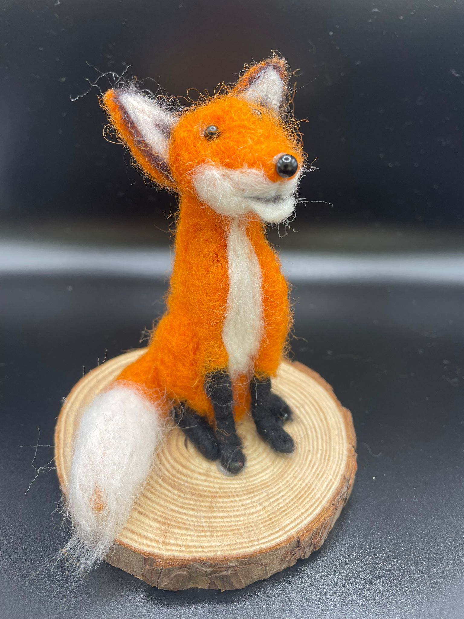 Needle felt fox on a natural wood slice base