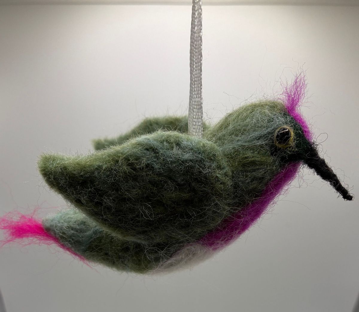 Needle felt hanging hummingbird in green and pink