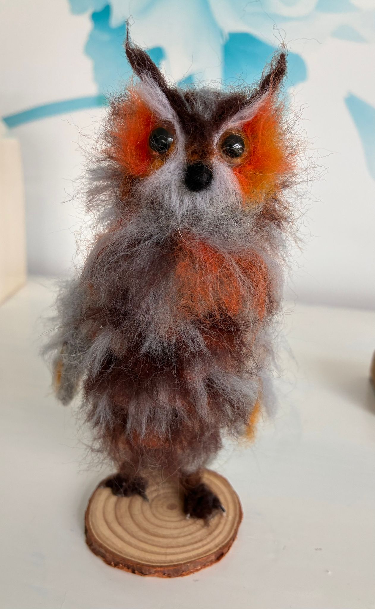 Needle felt owl on wood slice