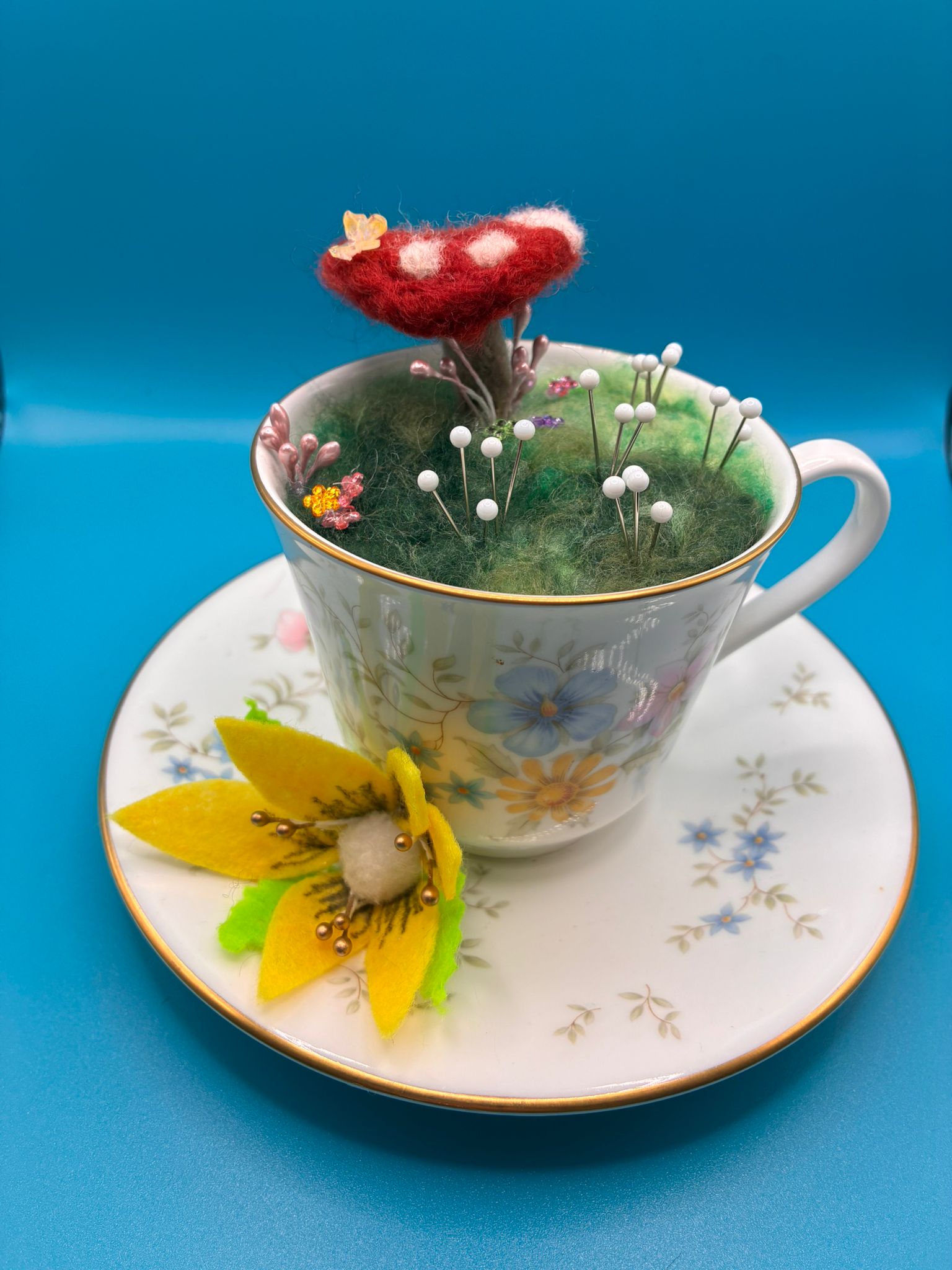 Needle felt pin cushion in vintage teacup with toadstool