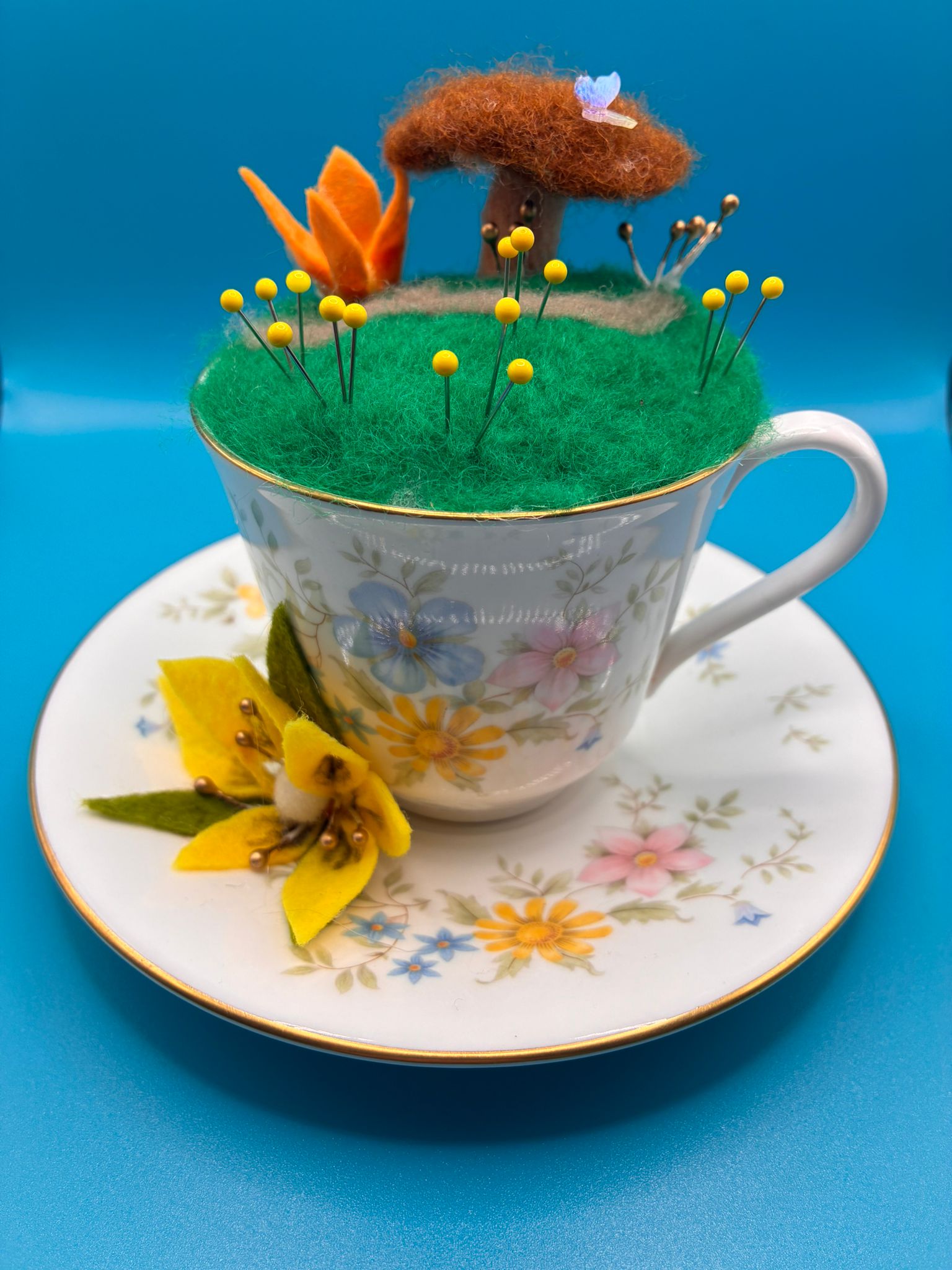 Needle felt pin cushion in vintage teacup with tree and butterfly