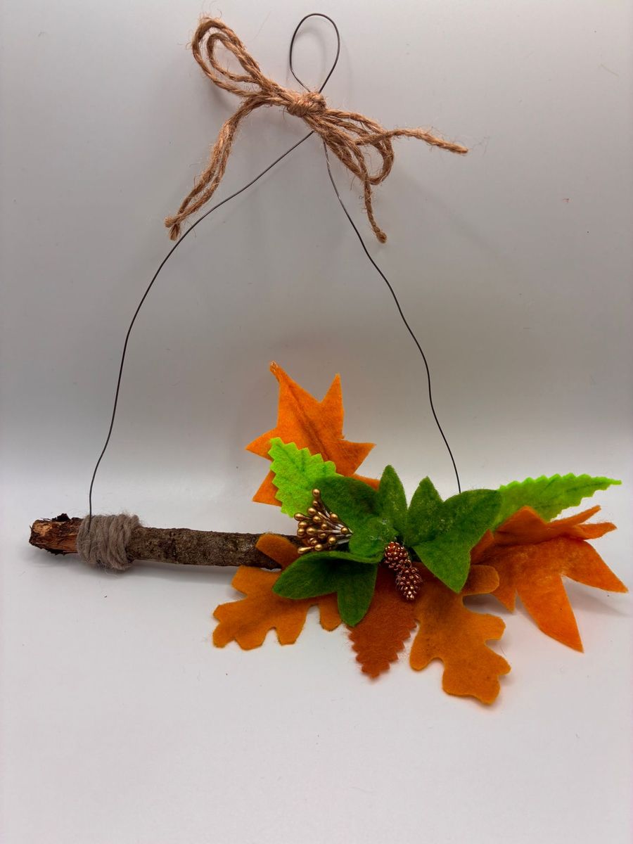 Felt autumn leaves and berries on hanging twig