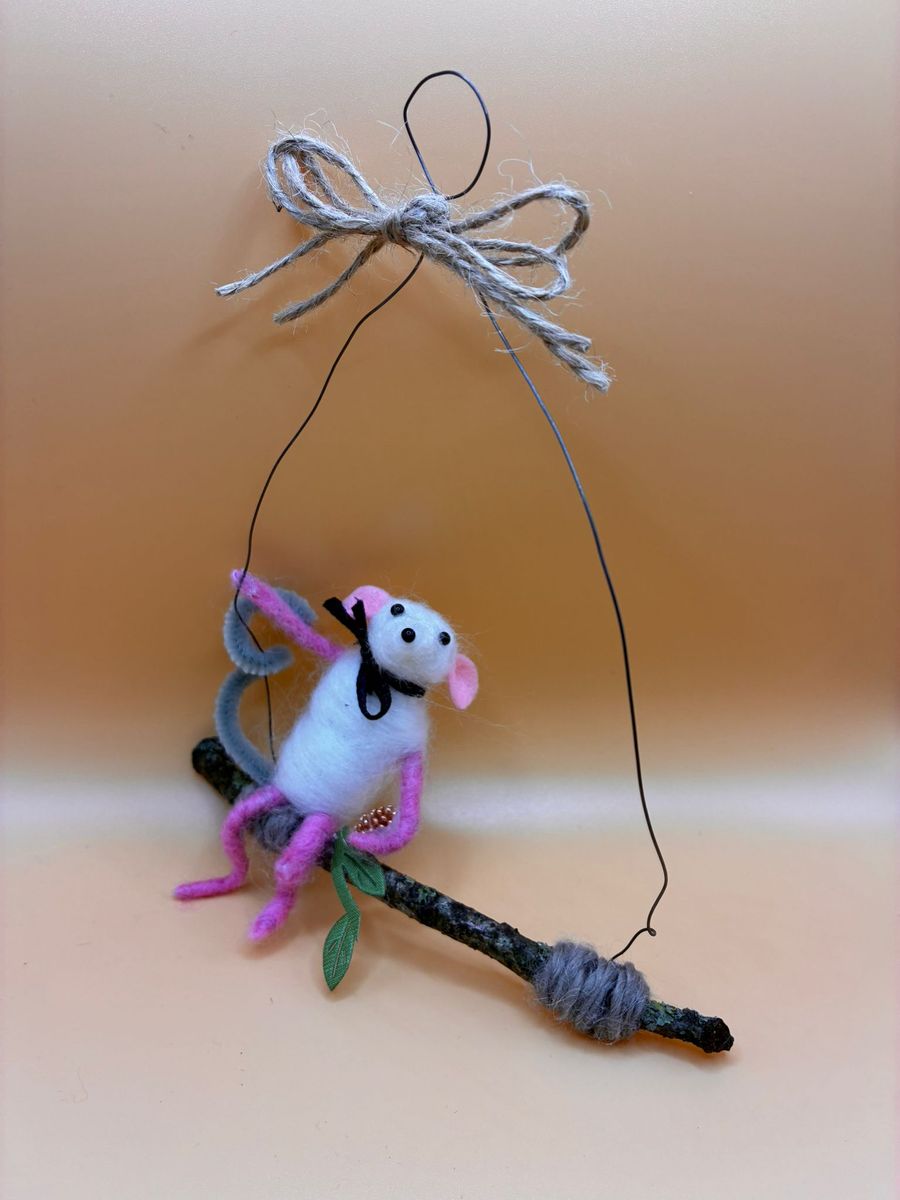 Needle felt mouse sitting on hanging twig