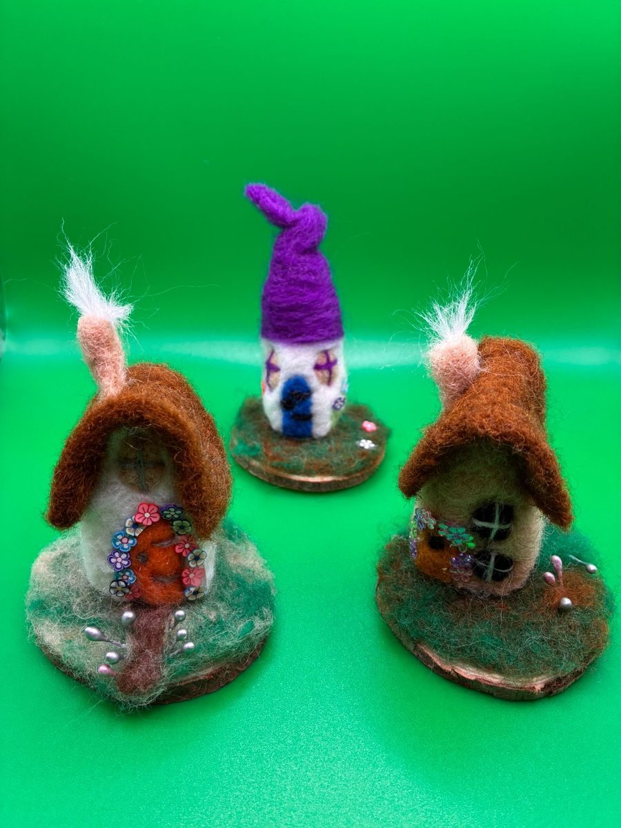 Needle felt fairy cottages on mossy wood bases