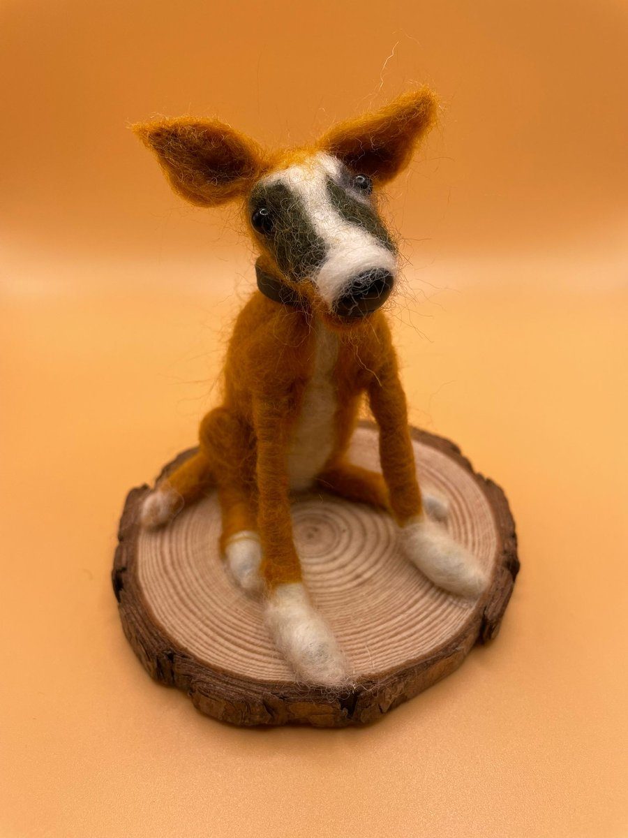 Needle felt tan and white dog on wood slice